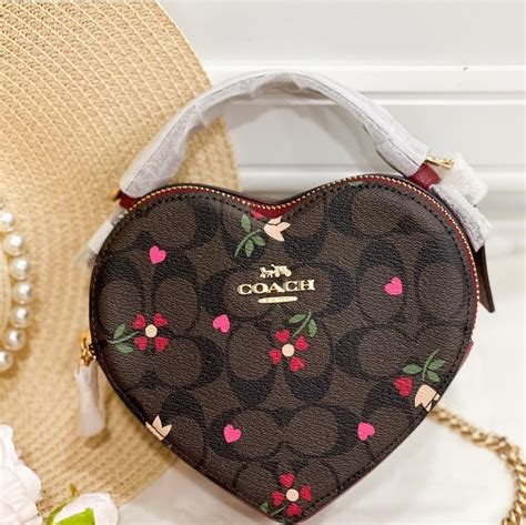 coach purse with heart print.